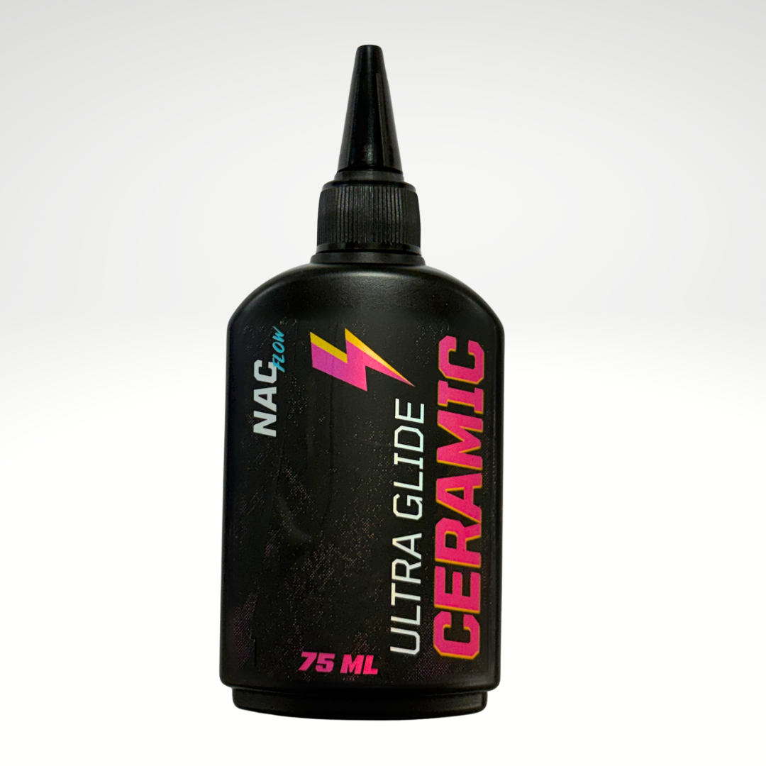 A 75 ml squeeze bottle of NAC Ultra Glide Ceramic wax, featuring a black body and cap with pink, white, and yellow branding on a light gray gradient background.