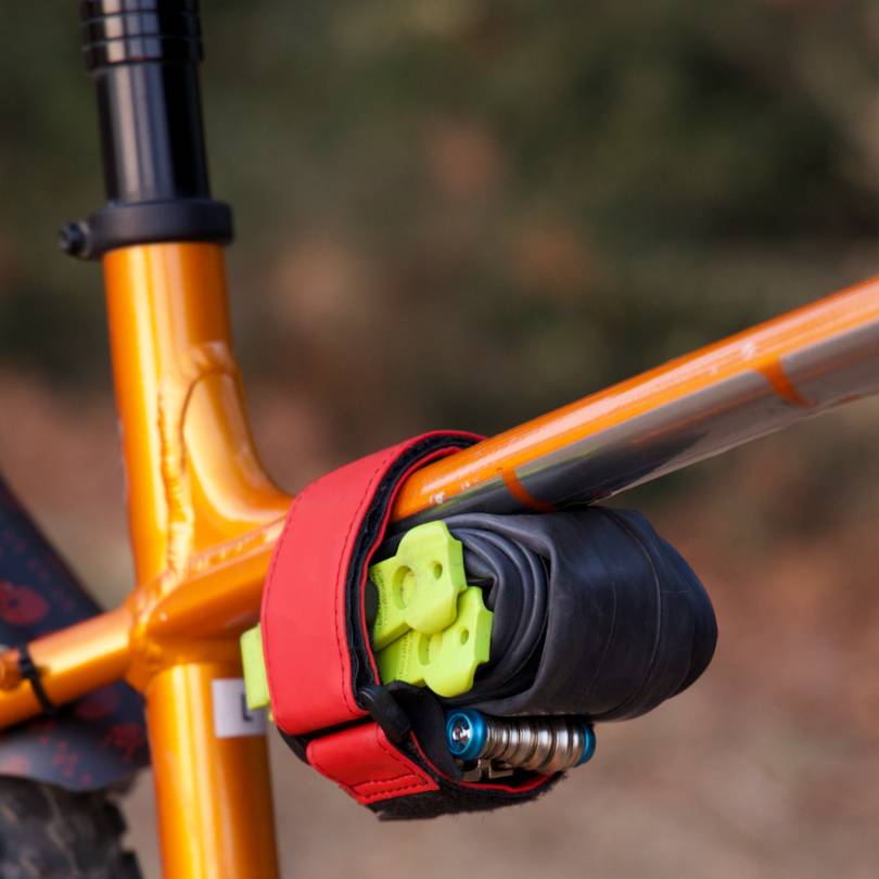 red storage strap for cycling tools and spares