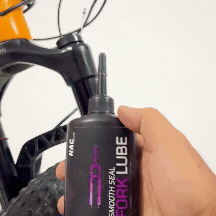 Applying NAC Smooth Seal lube to MTB fork seals