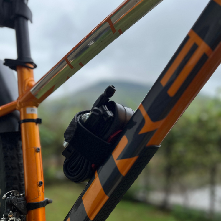 Metal strap mount for mountain bike to carry spare tube, CO2 Cartridges, multitool and accessories